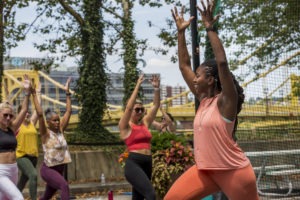 Alecia Dawn leads an outdoor yoga class at the Allegheny Overlook Pop-up Park on Ft. Duquesne Boulevard in Downtown Pittsburgh.