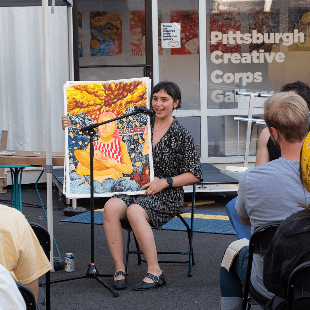 Artist Rosabel Rosalind during her artist talk and reception at the Pittsburgh Creative Corps Gallery in the park at 8th Street and Penn Avenue